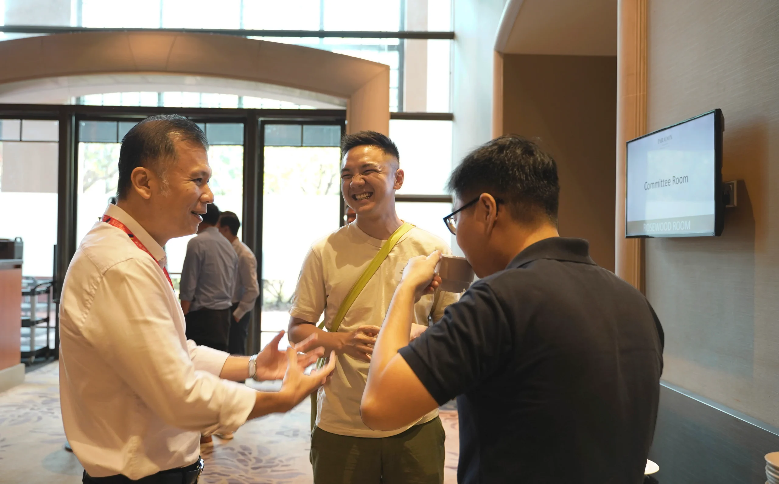 Participants from social services are gleefully exchanging ideas and building connections to drive meaningful change using A.I. in the community.
